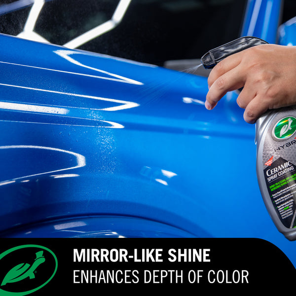 Person applying ceramic spray coating to a blue car surface with text highlighting mirror-like shine.