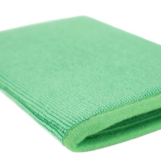 Close-up on a light green, synthetic clay mitt for car detailing. Ideal for pre-paint cleaning. Use for automotive surface preparation.