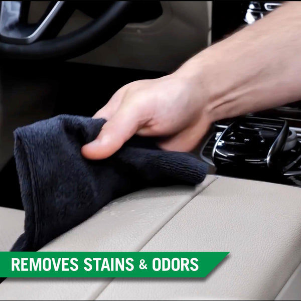 Detailing car interior. A cloth is cleaning leather seats. Cleaning dashboard. Auto valet. Turtle Wax not present.
