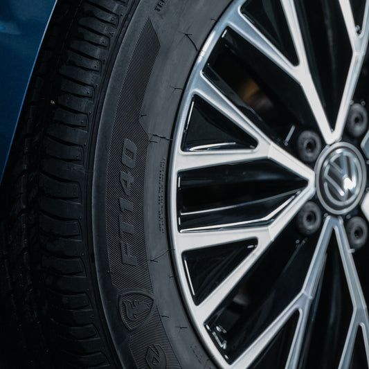Close-up of a car tyre with a sleek, modern wheel. Turtle Wax maintains the look.