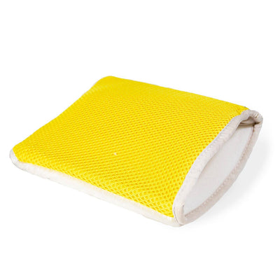 Yellow, meshed auto detailing mitt. Soft, white lining. Cleaning accessory for vehicle interiors. Yellow, meshed auto detailing mitt. Soft, white lining. Cleaning accessory for vehicle interiors.
