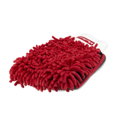 Close-up of a red, textured clay mitt. It is designed for car detailing and paint cleaning before waxing. Close-up of a red, textured clay mitt. It is designed for car detailing and paint cleaning before waxing.