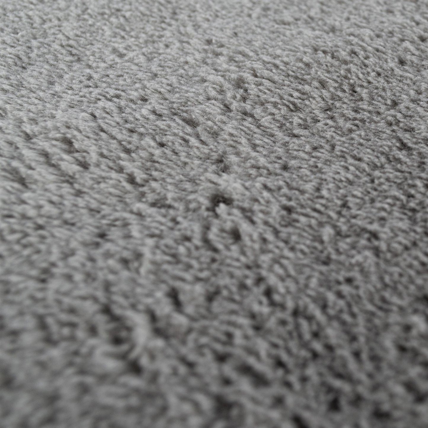 Close-up of a grey microfibre cloth. Soft textile for cleaning and detailing.