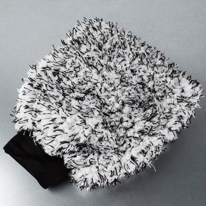 Fluffy microfibre car wash mitt with black and white strands. Soft, absorbent, and durable. Perfect car detailing accessory.