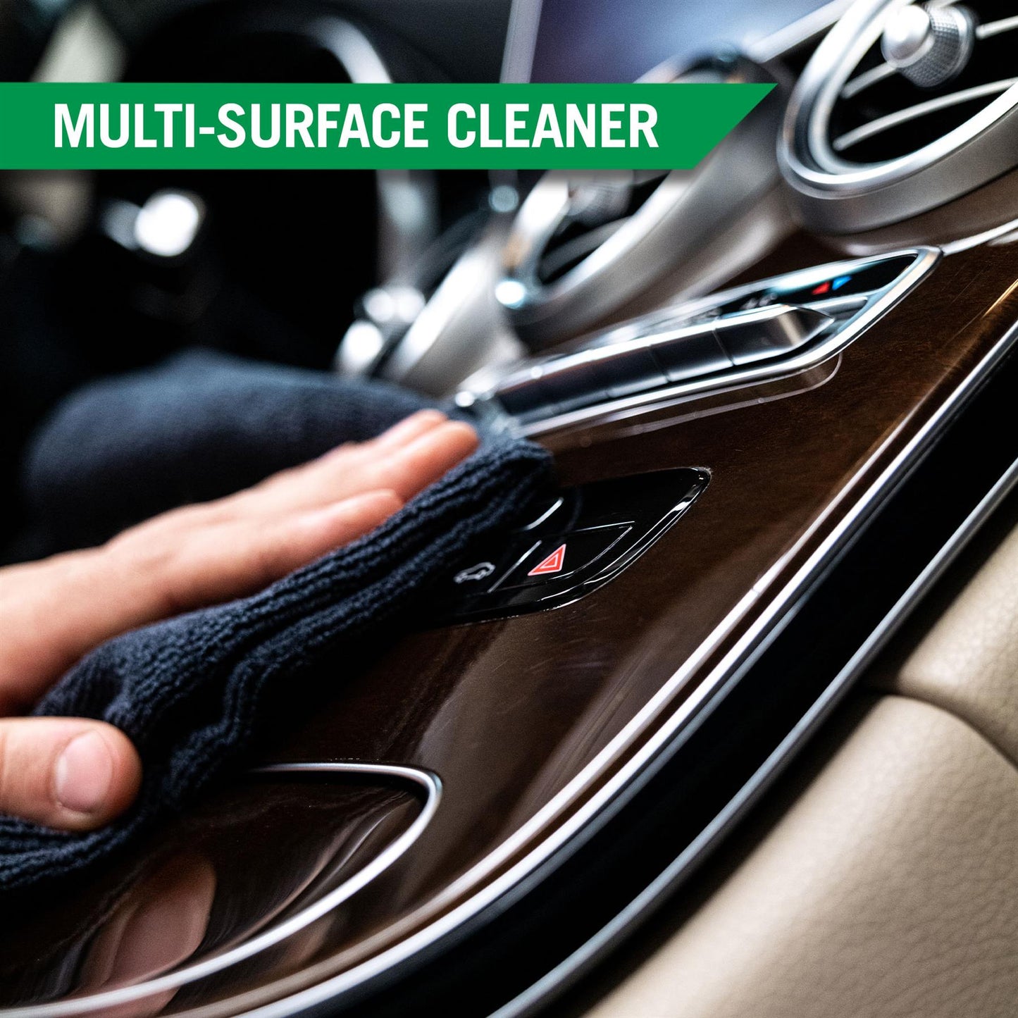 Cleaning a car's interior. Wiping a wood-grain trim with a cloth. Car detailing essentials.