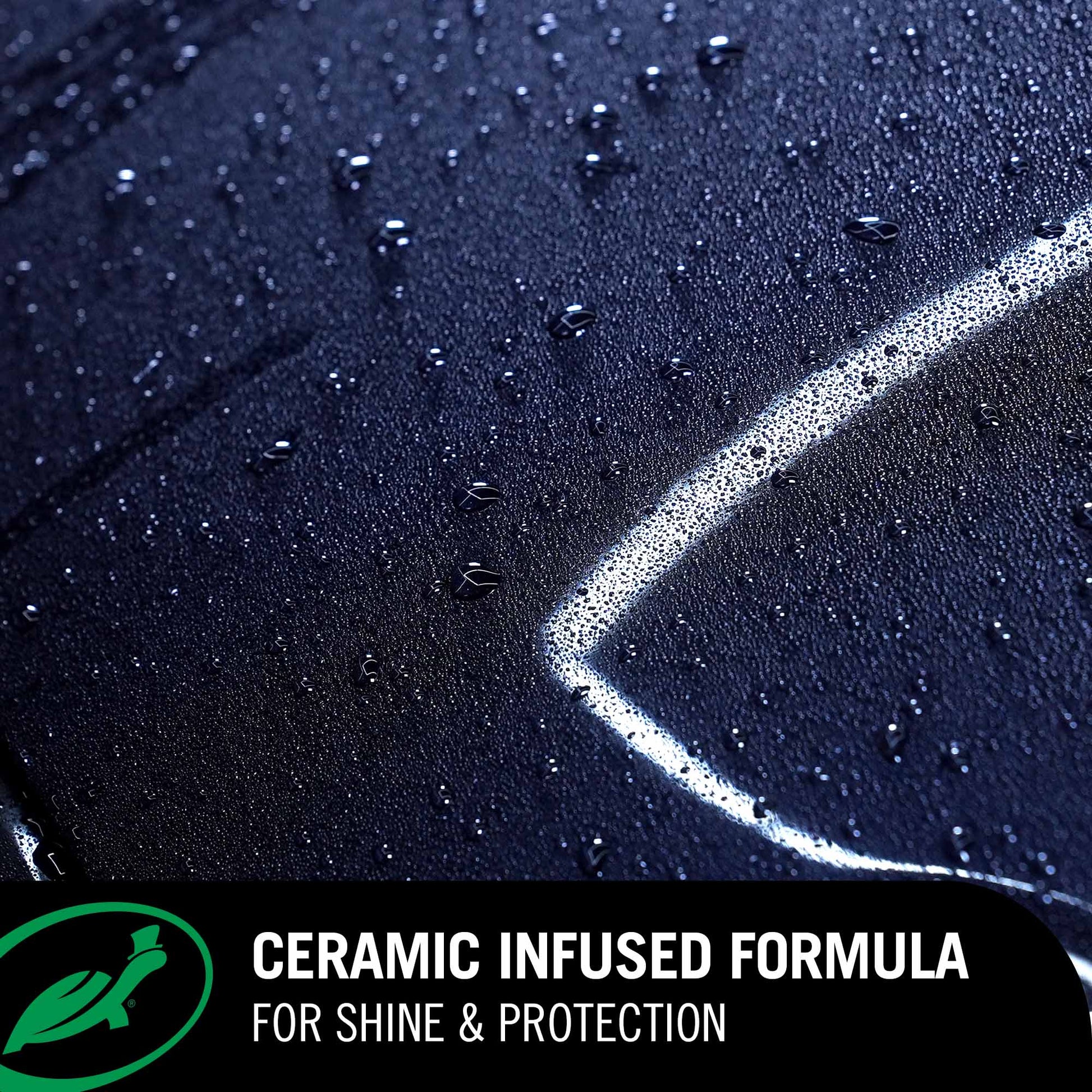 Close-up of a car surface with water droplets and a ceramic infused formula label.