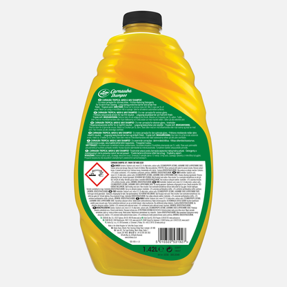 Yellow Turtle Wax back of bottle showing Carnauba Shampoo. Features Turtle Wax logo, car wash application, tropical scent icon, and water repellency claims.

