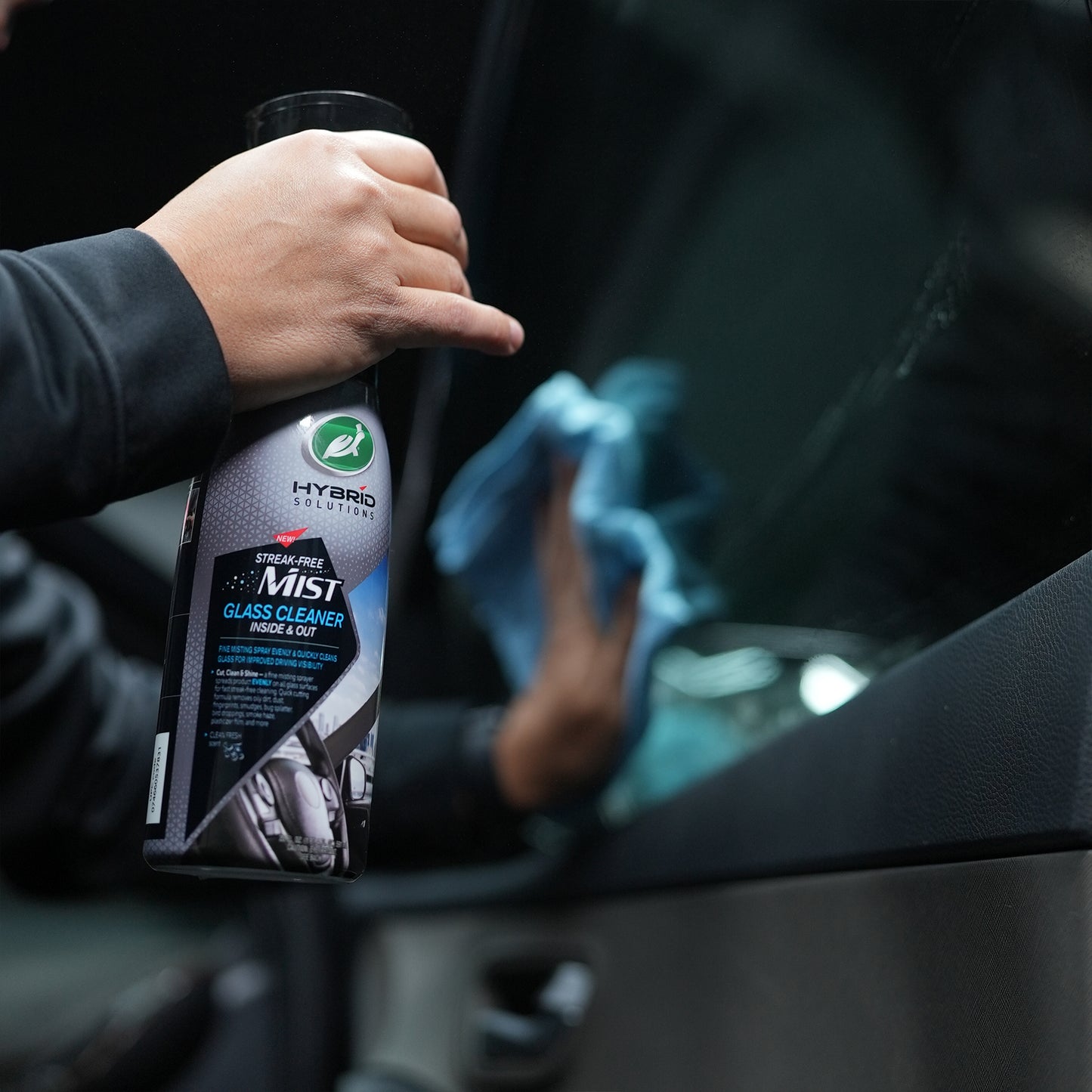 Car valeting with Turtle Wax Hybrid Solutions glass cleaner. Streak-free mist for both inside and outside automotive glass.