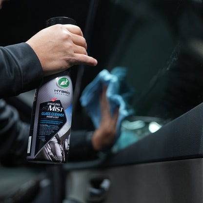 Car valeting with Turtle Wax Hybrid Solutions glass cleaner. Streak-free mist for both inside and outside automotive glass.