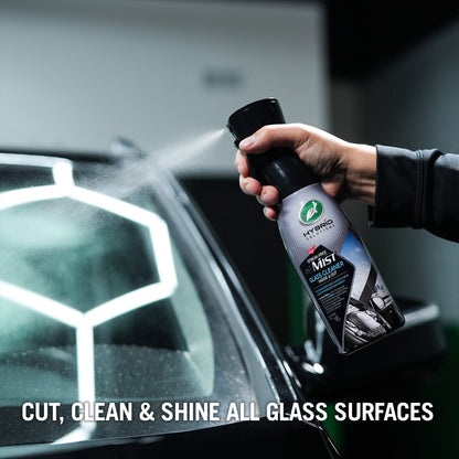 Turtle Wax Hybrid Solutions Streak-Free Mist being sprayed onto a car windscreen.  For cleaning car windows and interiors.