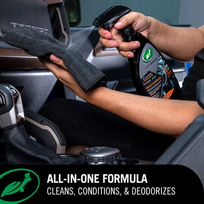 Person cleaning car interior with a Ceramic & Graphene Inside Job and towel, 