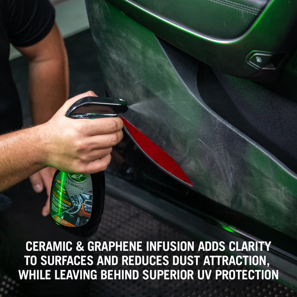HS Inside Job spray bottle placed in a vehicle interior setting, focused on dashboard surface for detailing product context.