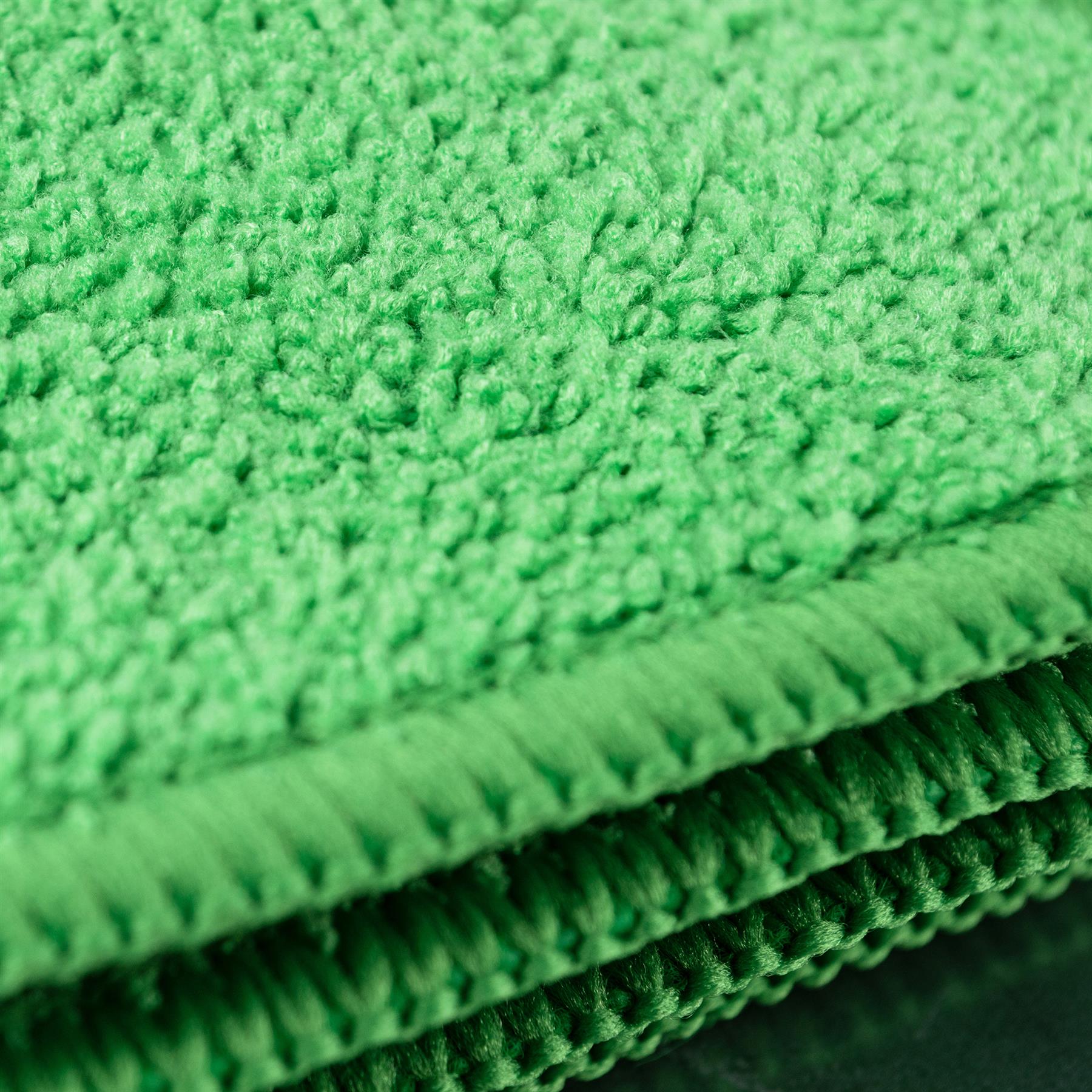 Close-up of bright green, absorbent, microfibre cloths. Ideal for cleaning tasks.