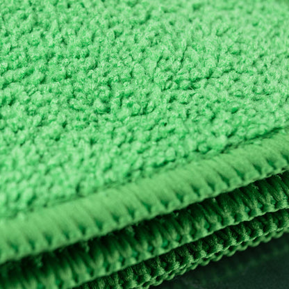 Close-up of bright green, absorbent, microfibre cloths. Ideal for cleaning tasks.