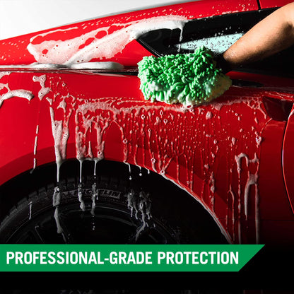 Washing a red car with foamy Turtle Wax car shampoo and a green wash mitt, leaving a streak-free shine.