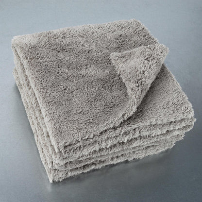 Stack of grey, ultimate microfibre cloths for car detailing.