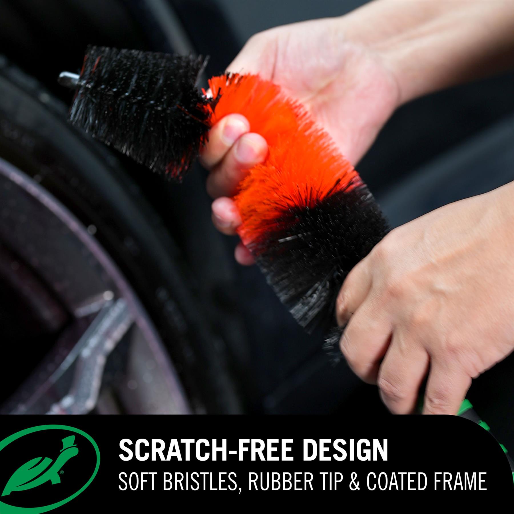 Person holding a Red Line Wheel Brush with red bristles and black handle, with text about the product's features. (scratch free design)