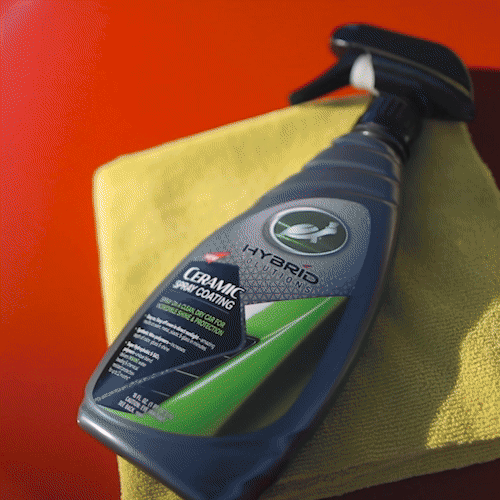 Animated GIF showing the application of HS Ceramic Spray, highlighting the product being sprayed evenly on a car surface and then wiped for a glossy finish.