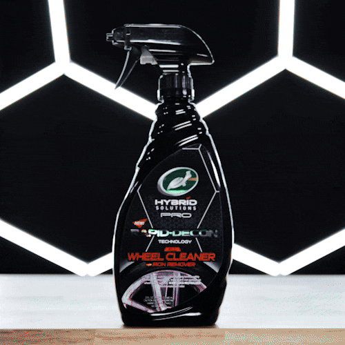 Turtle Wax Hybrid Solutions Pro wheel cleaner with iron remover, shown in black bottle with spray nozzle. Car detailing product.
