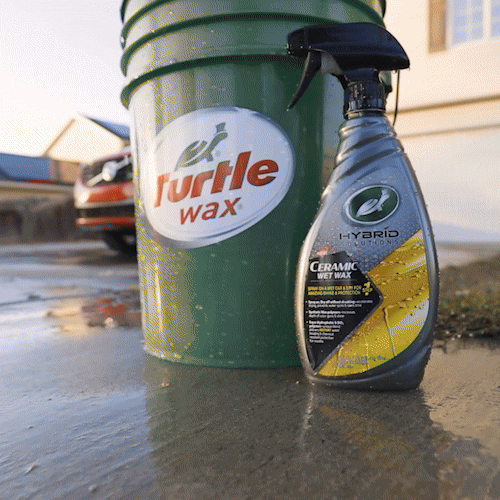 Turtle Wax Hybrid Solutions Ceramic Wet Wax, next to a Turtle Wax bucket. Car care for a shiny, protected finish on wet or dry surfaces.
