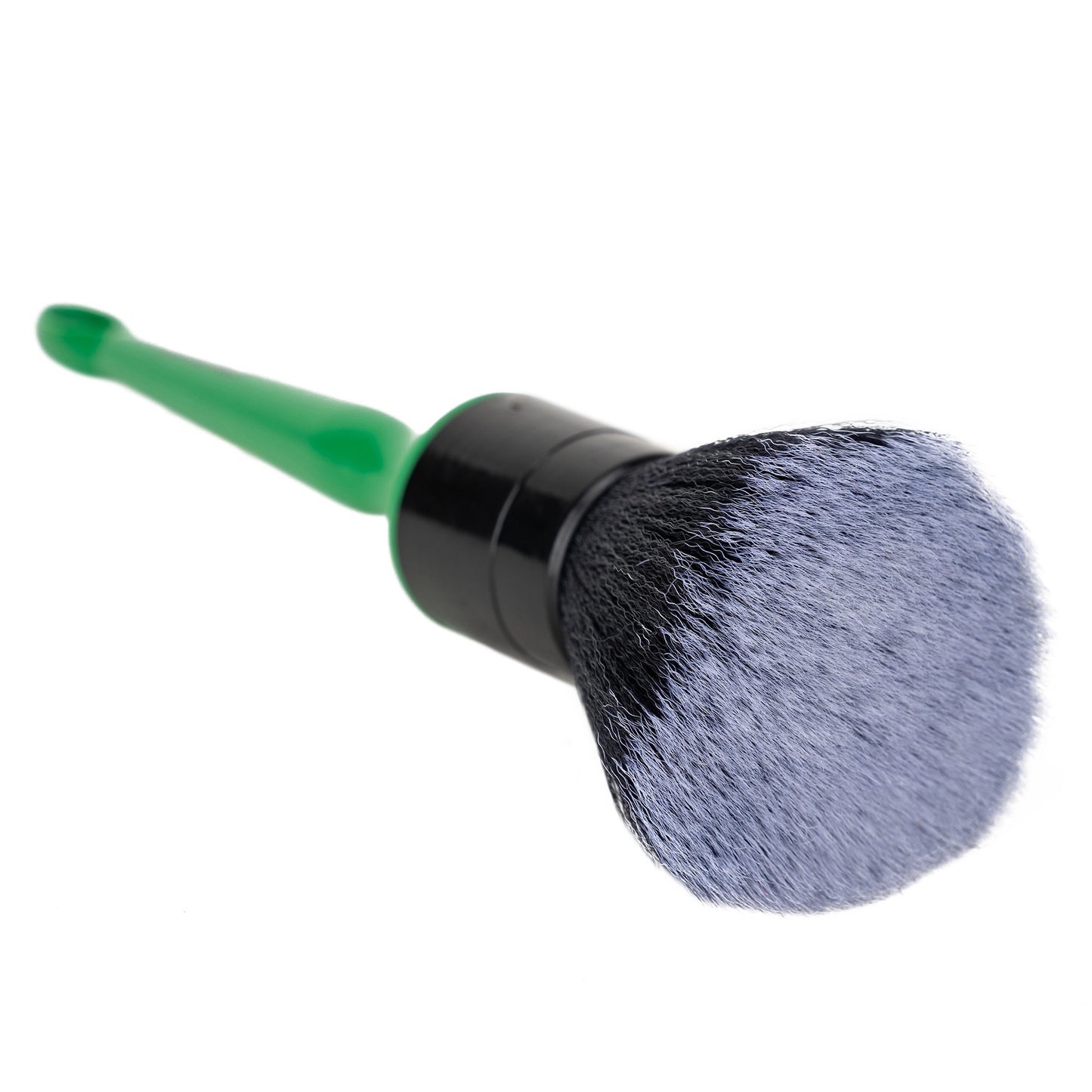 Car detailing brush with a green handle and dark bristles. Perfect for cleaning interiors.