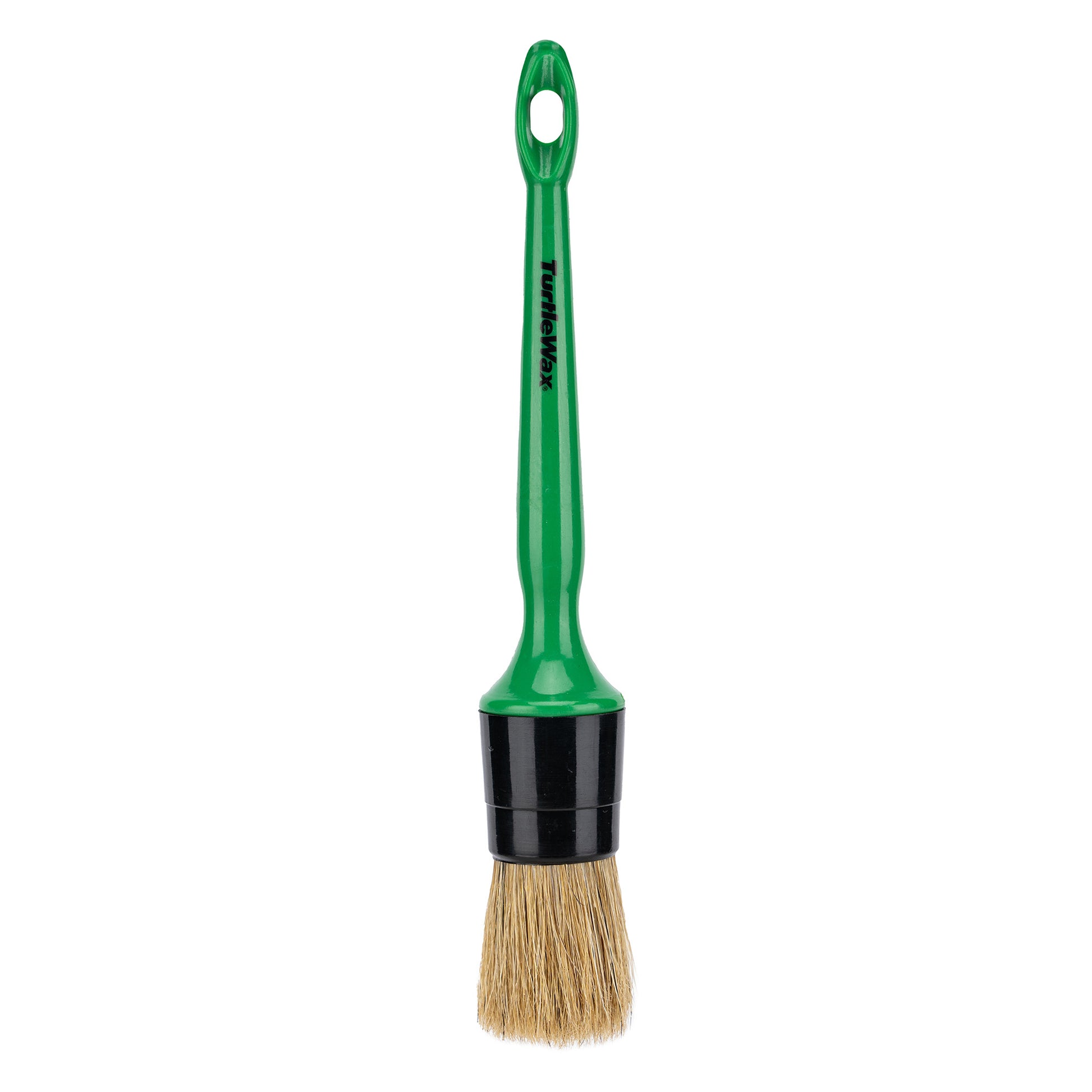Turtle Wax detailing brush with a green handle. Tool with bristles for car interior cleaning.