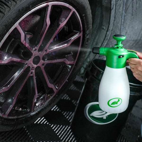 Turtle Wax product spraying wheel cleaner onto a car wheel. Car detailing equipment for valeting services in the UK.
