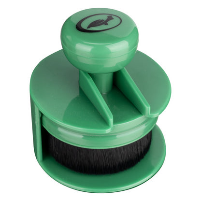 Here's a description following all the constraints:

Green Turtle Wax tyre applicator featuring a bristle brush, designed for dressing application.