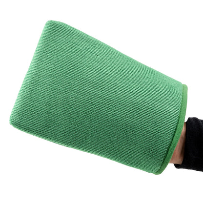 Green synthetic mitt for vehicle detailing, held on a hand. Preps surfaces using synthetic "clay" technology.