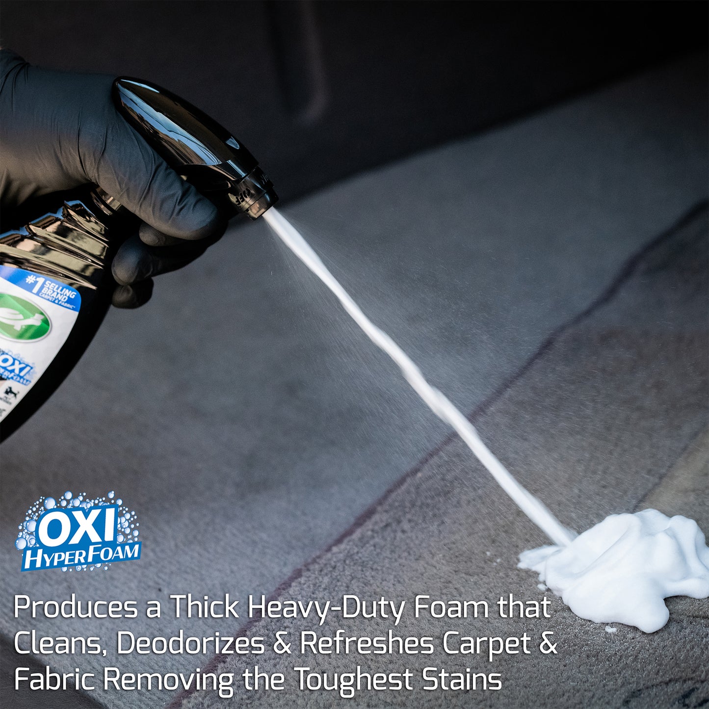 Detailer sprays a foamy cleaner on fabric to remove stains and odors.  Oxi Hyperfoam cleans car interiors.

