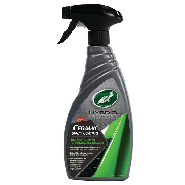 Close-up image of a detailing product bottle with a bold black and red label, featuring ergonomic grip and placed on a concrete surface for a rugged look.