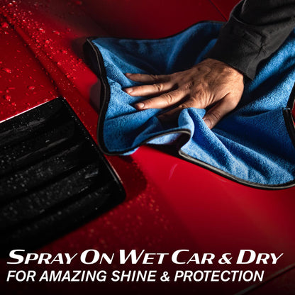 Detailing a red car with Turtle Wax products. Microfibre cloth polishing wet surface for a protective ceramic finish.