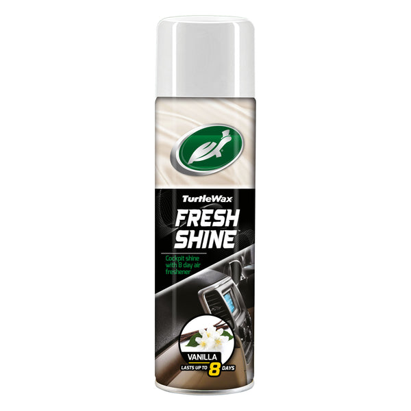 Front-facing image of Turtle Wax Fresh Shine interior cleaner in a 500ml aerosol can with a yellow cap. The label features a citrus swirl design and states the Vanilla fragrance with long-lasting air freshening up to 8 days. Designed for dashboard and cockpit surfaces.