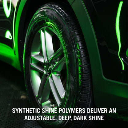 Shiny black Kumho tyres, enhanced with Turtle Wax Hybrid Solutions Graphene, showcased on a car with striking green accents.