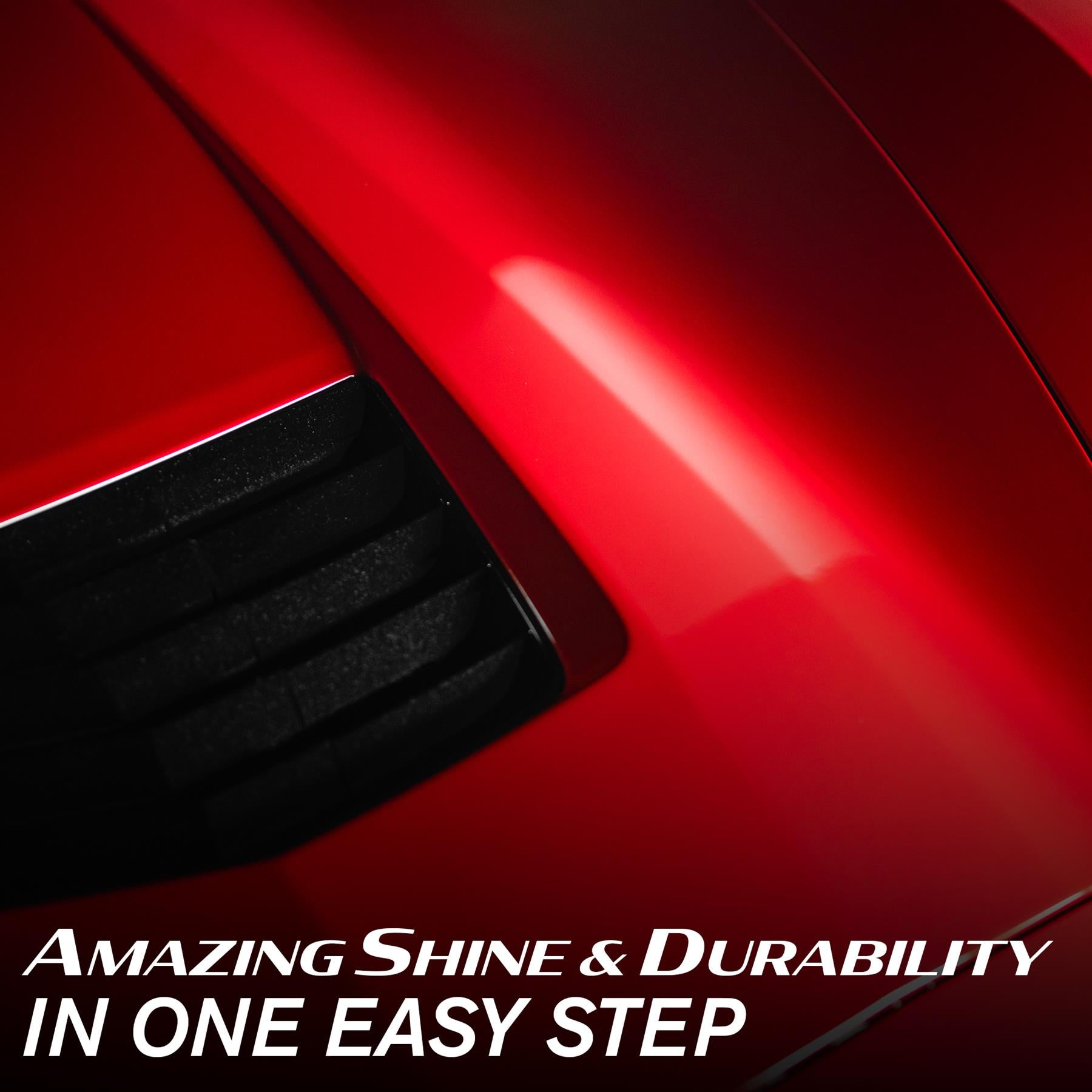 Close-up of a glossy red car surface with black vents. Turtle Wax quality finish.
