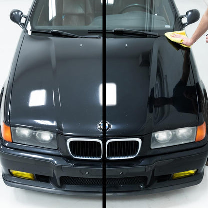 Before-and-after shot of a black car bonnet, showing paint correction and enhanced gloss from a polishing compound. Detailing car.
