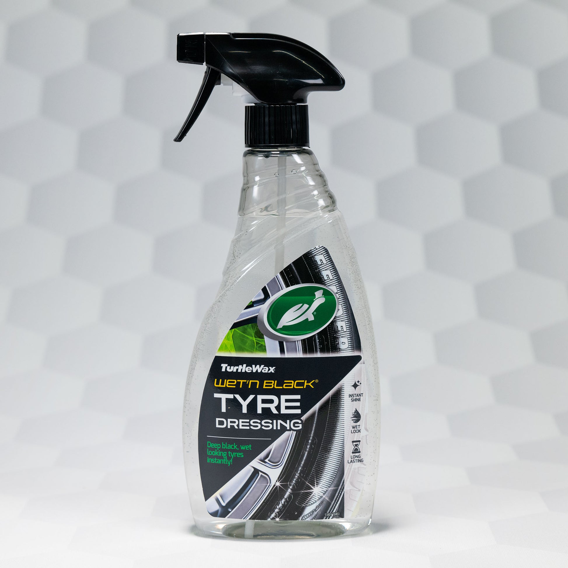 Turtle Wax Wet'n Black tyre dressing for deep black, wet-look tyres. 500ml clear bottle with a black spray nozzle and automotive styling.