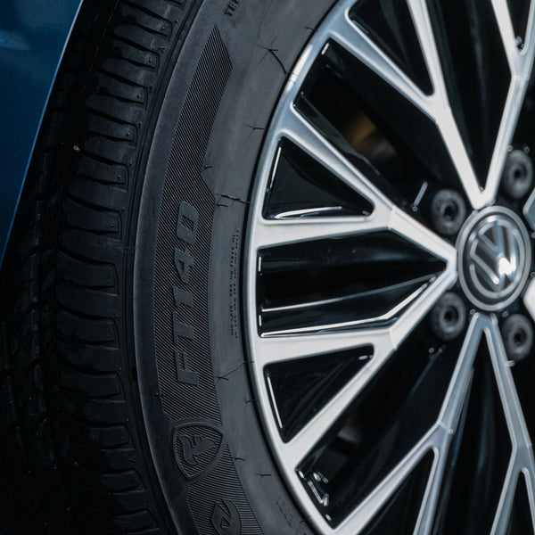 Close-up of a car tyre with a sleek, modern wheel. Turtle Wax maintains the look.