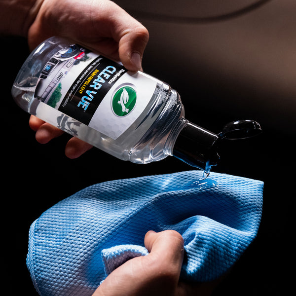 Photograph of a microfiber cleaning cloth, showcasing its plush fibers and stitched edges, ideal for streak-free cleaning of automotive surfaces.