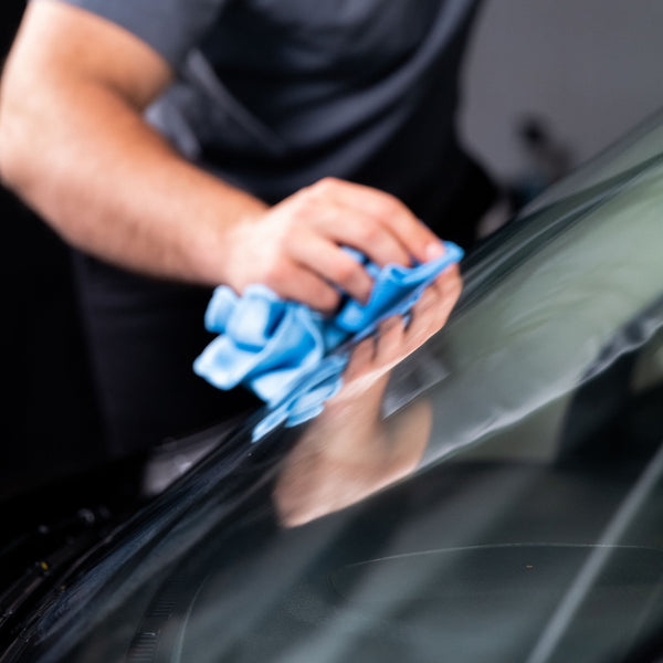 Image of a detailing brush set, featuring various brush sizes with soft bristles, intended for cleaning intricate parts of a vehicle's interior and exterior.