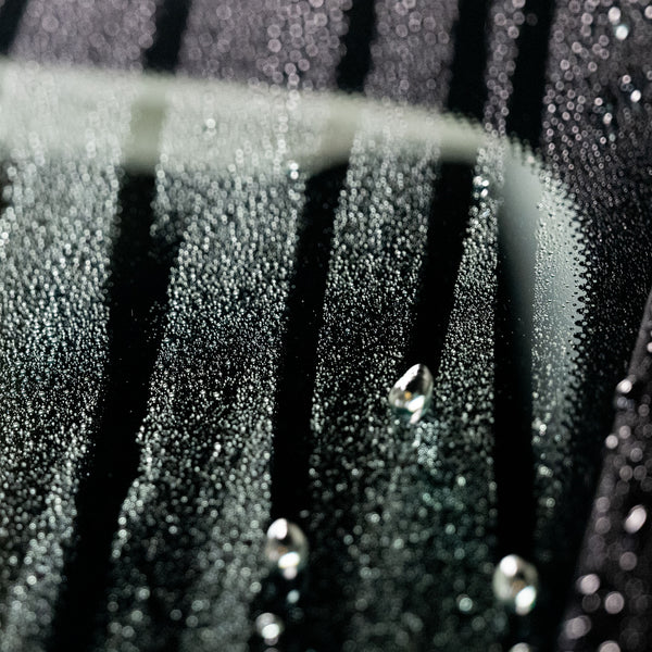 Image capturing a car polish applicator pad, highlighting its texture and ergonomic shape, designed for efficient application of polishing products.