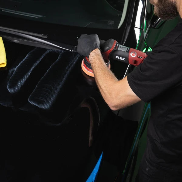 HS Pro 1 & Done placed on a shiny vehicle fender with water droplets highlighting protection