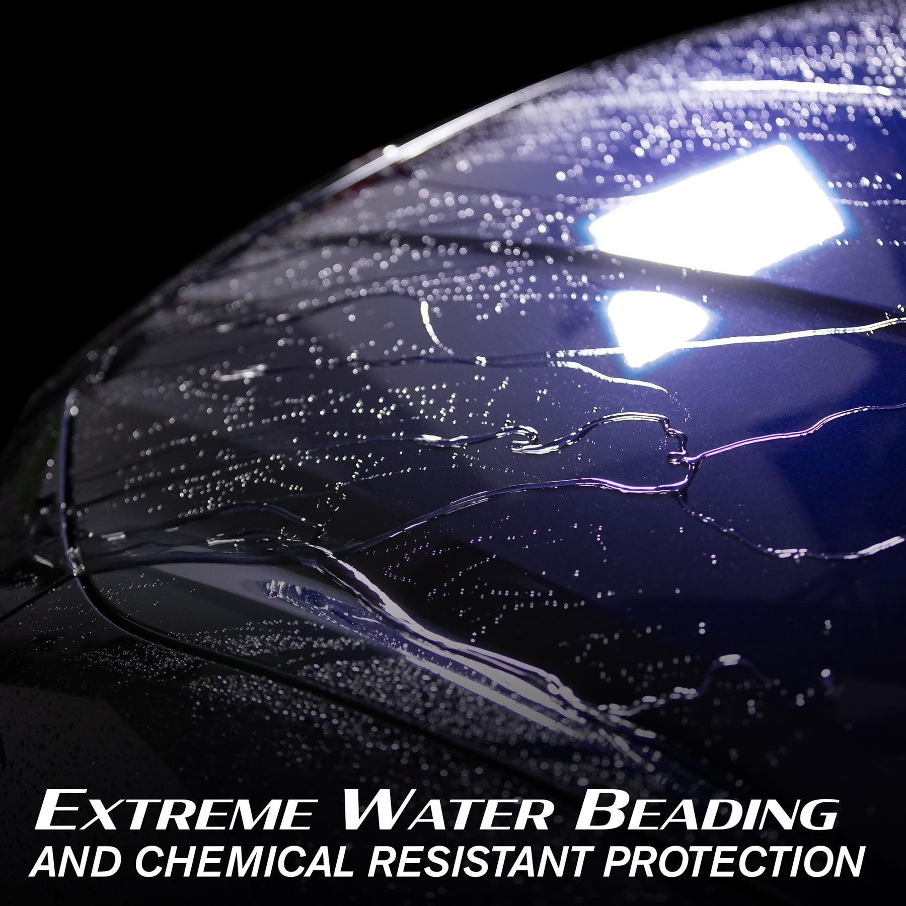 Water beading on a blue car bonnet, showcasing Turtle Wax Hybrid Solutions car care protection in a close-up.