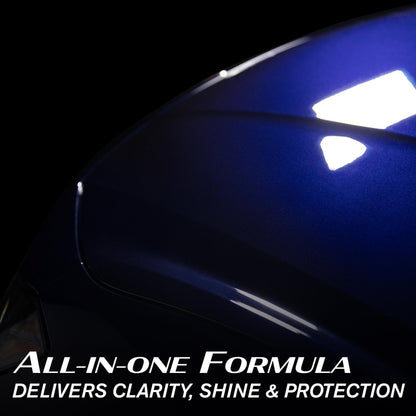 Glossy, deep blue car paint with light reflections. All-in-one Turtle Wax formula delivering clarity, shine and protection.